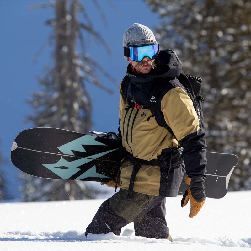 Jones team rider Taylor Carlton wearing the Mountain Surf parka in Summit Khaki