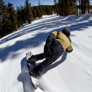 Jones team rider Jimmy Goodman wearing the Mountain Surf bib in stealth black