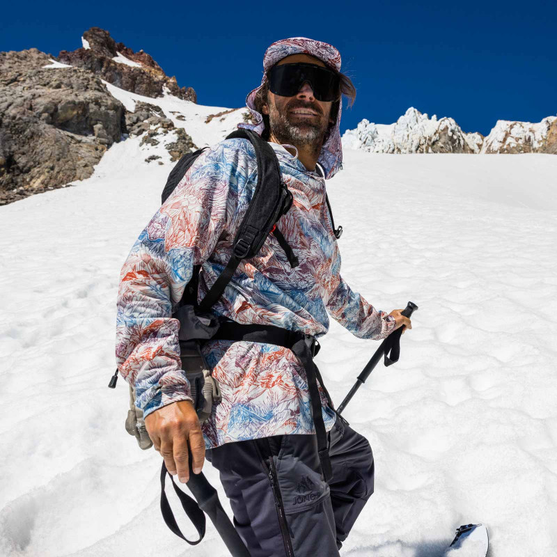 Jeremy Jones wears the Shasta Recycled Tech Hoodie during a spring splitboarding session.
